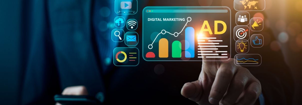 A person in a suit uses a smartphone and points at a virtual screen displaying digital marketing icons, analytics graphs, and the word AD with bright, colorful graphics.