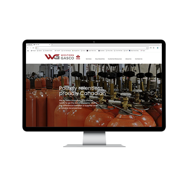 AG Client Page Western Gasco BV4 A computer monitor displaying the Western Gasco website homepage, featuring a background of orange industrial gas cylinders and the text Politely relentless, proudly Canadian.