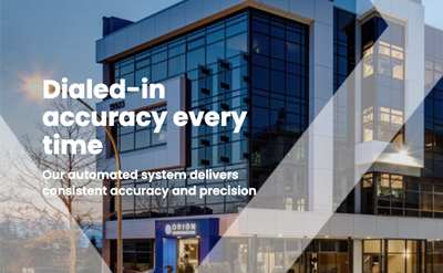 A modern multi-story office building with text overlay that reads: Dialed-in accuracy every time. Our automated system delivers consistent accuracy and precision.